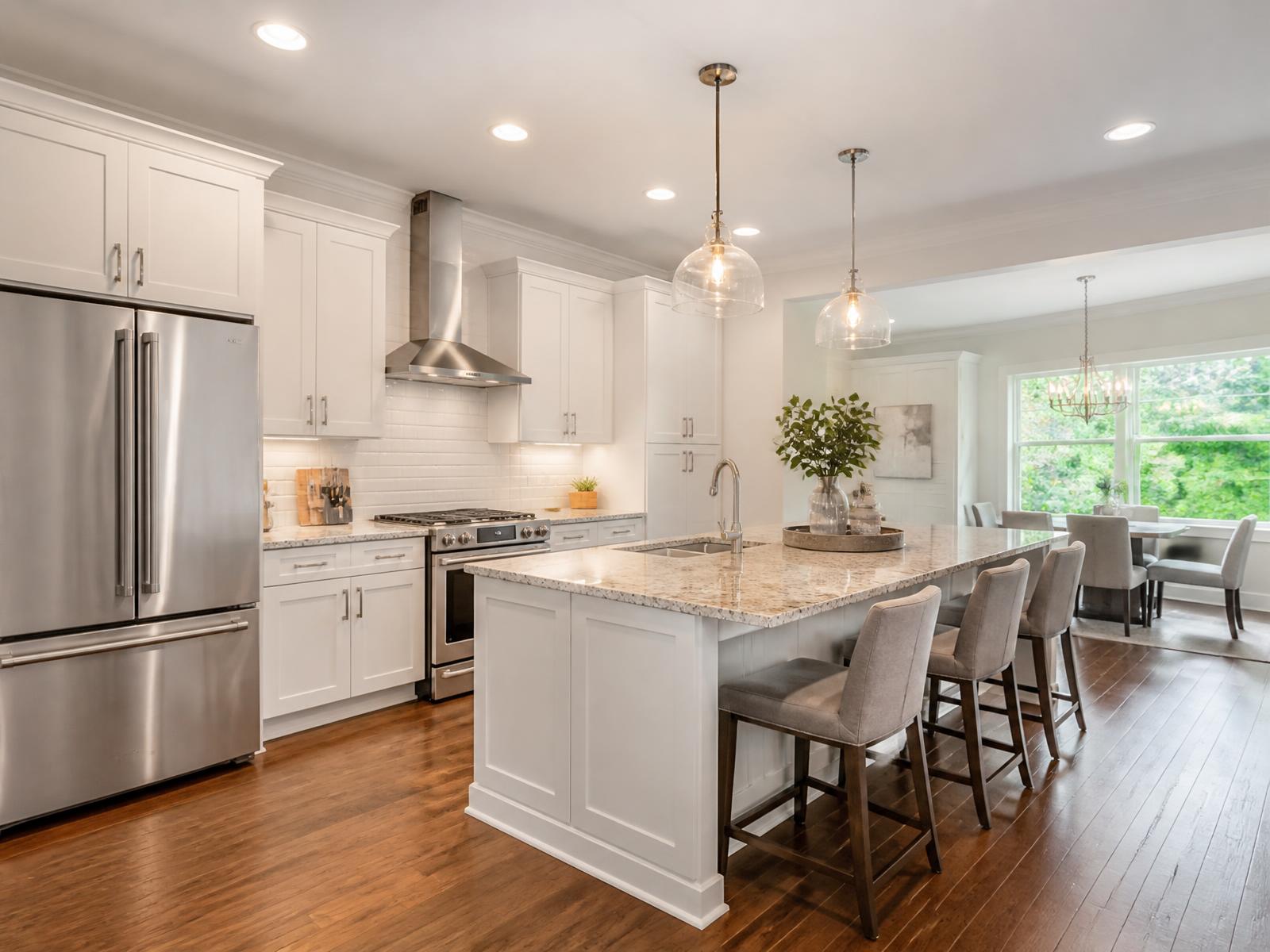 Updated kitchen with granite counters and stainless steel appliances